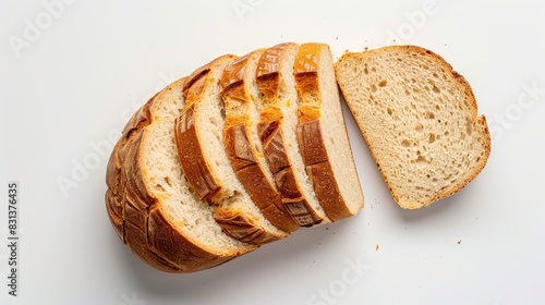 Loaf of bread sliced and set against white backdrop