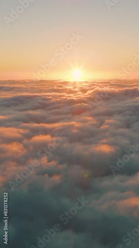 Top view of the clouds in the morning light. Aerial view of cumulus clouds. Sunlighten cumulus clouds under horizon. over the cumulus clouds in the morning. photo