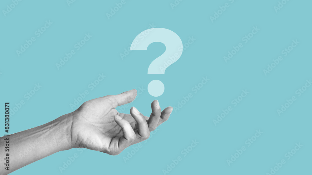 Female hand holding question mark icon on blue background. Banner with copy space. Place for text or icon Female hand holding question mark icon on blue background. Banner with copy space. Place for text or icon