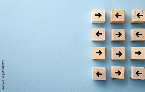 Wooden Blocks with Up and Down Arrows on Light Blue Background