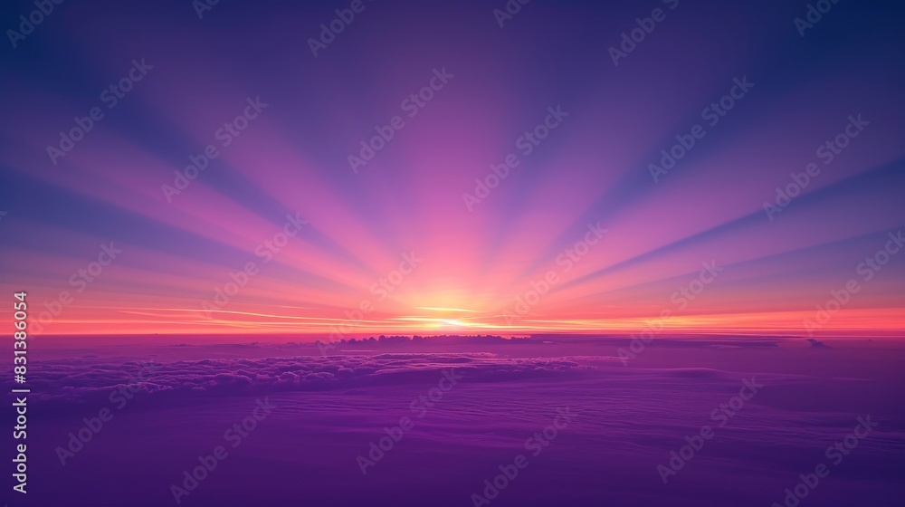 Fototapeta premium View of the sky at dawn, featuring a smooth gradient from deep purple to soft pink
