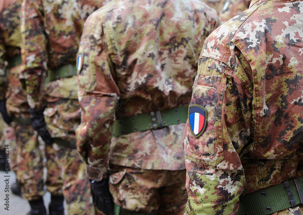 french army soldier in green and brown camouflage uniform with the flag of France french army soldier in green and brown camouflage uniform with the flag of France