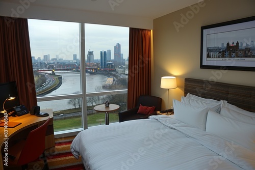 Comfortable hotel room with a city view  featuring a cozy bed and modern amenities for a relaxing and convenient stay