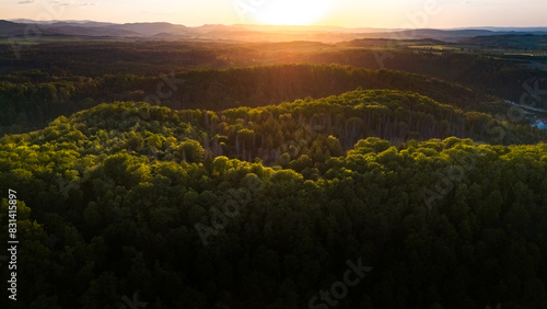 Fototapeta Naklejka Na Ścianę i Meble -  aerial view of forests on the hills at the foot of the mountains in poland in the spring at sunset