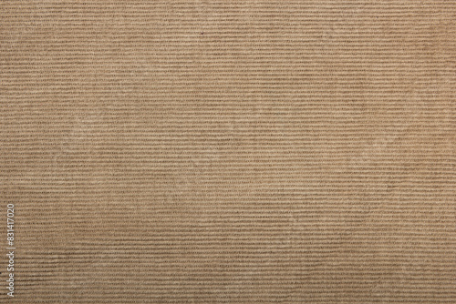 beige corduroy fabric background. slightly worn