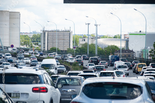 Fototapeta Naklejka Na Ścianę i Meble -  Driving in heavy traffic on ring road of capital of France, traffic jam problems in Paris
