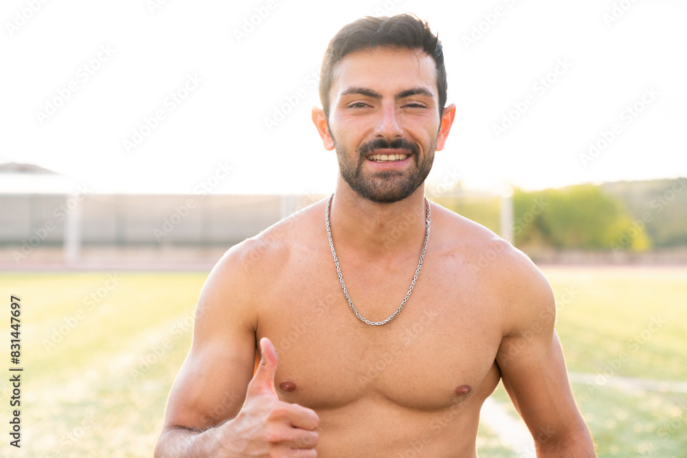 Close-up shot of naked athletic muscular athlete man Close-up shot of naked athletic muscular athlete man
