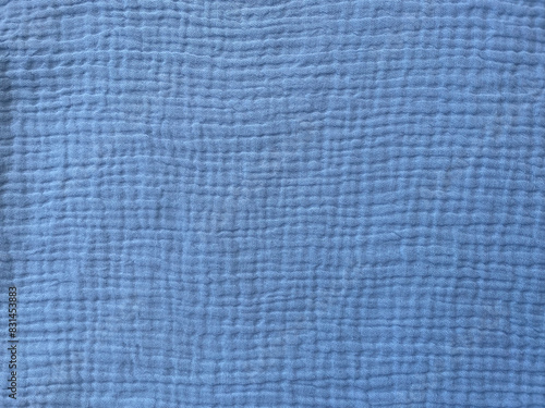 Muslin cloth texture background in blue tones. Cotton fabric structure