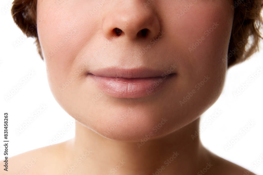 © master1305 - Cropped image of female face, chin and lips isolated on white background. Face building with massage, no double chin. Concept of natural beauty, skincare, wellness, cosmetology, cosmetics © master1305 - Cropped image of female face, chin and lips isolated on white background. Face building with massage, no double chin. Concept of natural beauty, skincare, wellness, cosmetology, cosmetics