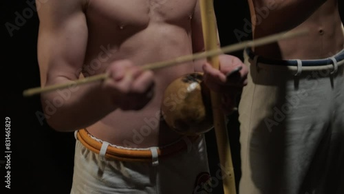 Close-Up of Man Playing Berimbau in Capoeira photo