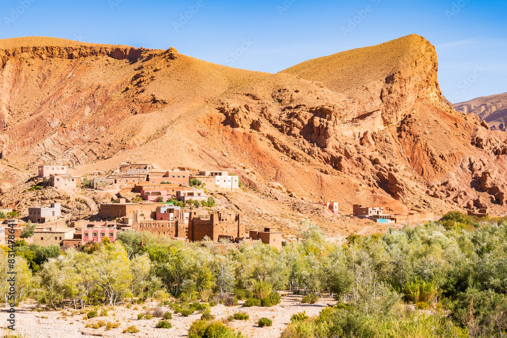 Fototapeta premium Traditional village with clay houses in mountain landscape of Dades valley, Morocco, North Africa