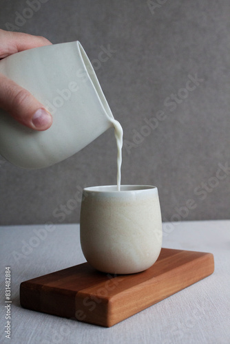 Pouring milk into a cup