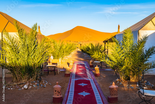 Luxury tent camp at Erg Chebbi Sahara desert at sunrise near Merzouga town, Morocco, North Africa