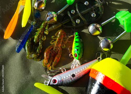 Fishing gear on a tarpaulin background. Background for a fishing theme. photo