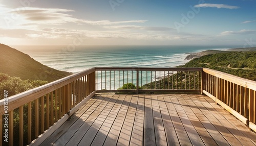 wooden deck with fence overlooking the ocean © joesph