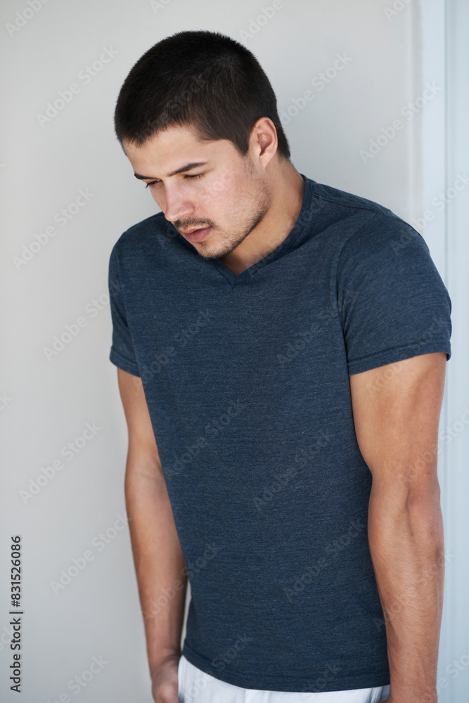 Man, thinking and fashion or clothes in home, casual outfit and contemplating designer t shirt. Male person, ponder and planning trend in apartment, calm and college student for style aesthetic Man, thinking and fashion or clothes in home, casual outfit and contemplating designer t shirt. Male person, ponder and planning trend in apartment, calm and college student for style aesthetic