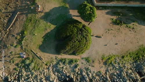 Aerial drone video. Blue Mediterranean Sea. Rocks and Trees. Breathtaking view.Sunset.Cap d'Antibes