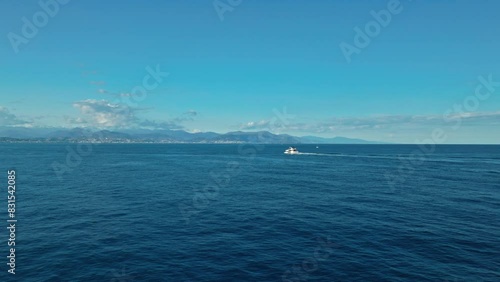 Aerial drone video. Blue Mediterranean Sea. Yacht. Breathtaking view.Cap d'Antibes