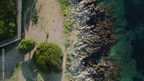 Aerial drone video. Blue Mediterranean Sea. Rocks and Trees. Breathtaking view.Sunset.Cap d'Antibes