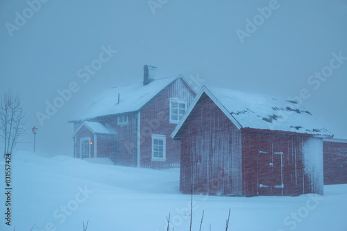 Swedish red houses in one of the strongest snowstorms of 2024, Hemavan, Sweden