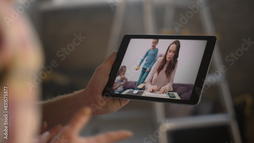 Family calling digital tablet indoors closeup. Distant couple videocalling