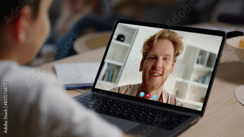 Online teacher videocalling kid online closeup. Smiling father talking web cam photo