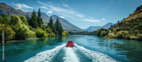 A group of people are on a boat in a river, enjoying the beautiful scenery photo