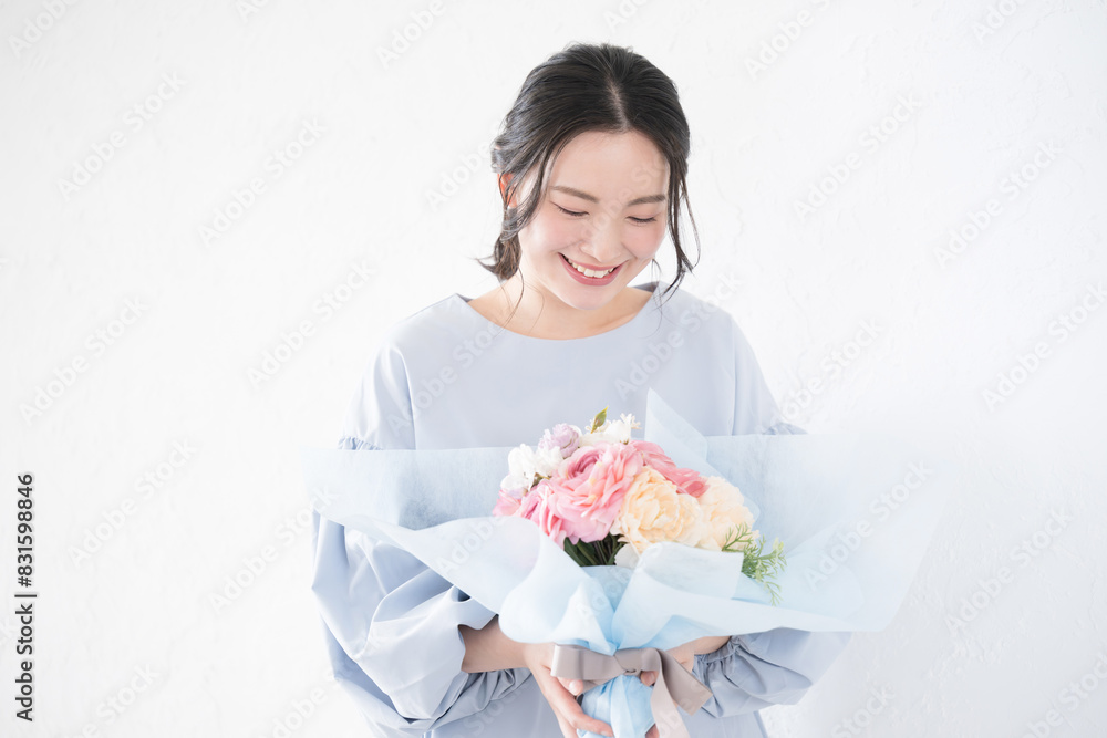 Young woman receiving a gift of flowers Young woman receiving a gift of flowers