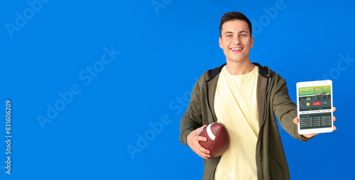 Young man with rugby ball a...