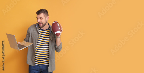 Young man with rugby ball a...