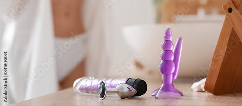 Sex toys on table of young ...