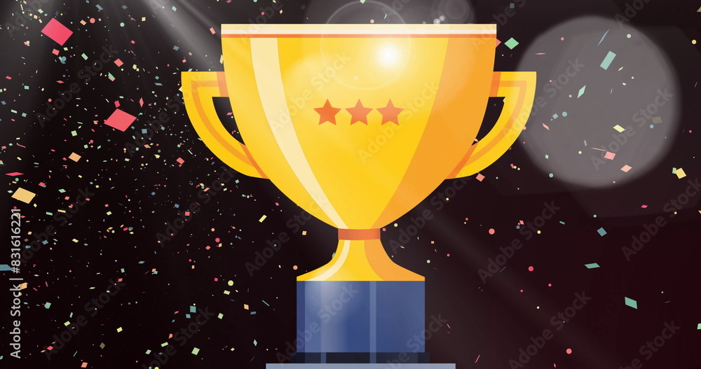 Image of gold cup and confetti floating on black background