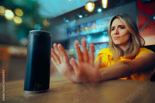 Woman Saying no to a Soda Energy Drink Full of Sugar. Girl making healthy choices refusing to drink sugary soft beverages 