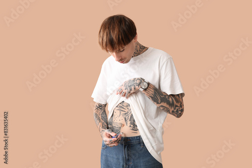 Diabetic young man using la...