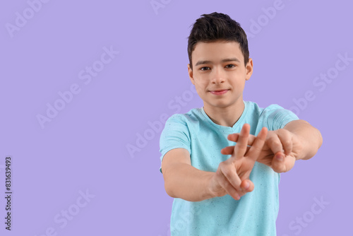 Young boy making hashtag ge...
