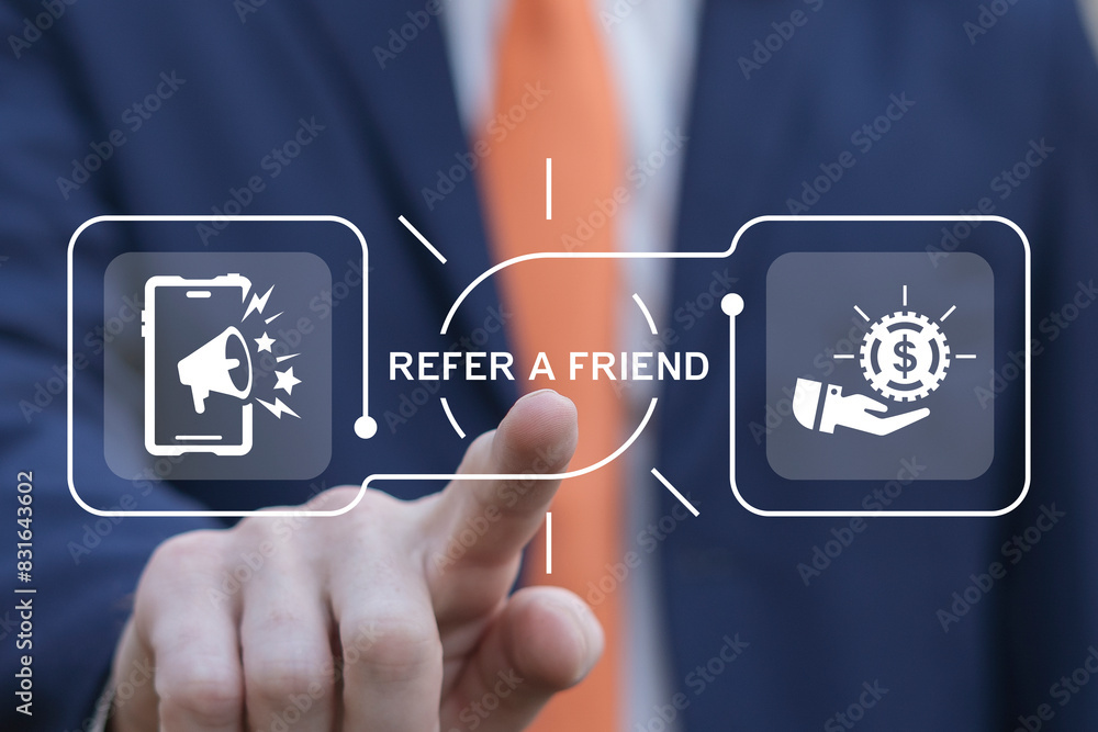 Business man using virtual screen presses text: REFER A FRIEND. Referral marketing or affiliate marketing concept. Invite friends to refer a friend loyalty program to win online reward. Refer and earn