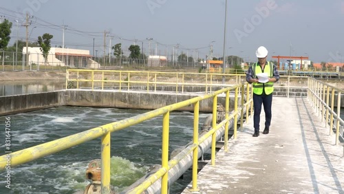 Service engineer checking on waste water treatment plant,Environmental engineers inspect quality at water plants,Technicians work at a water station to produce tap water.