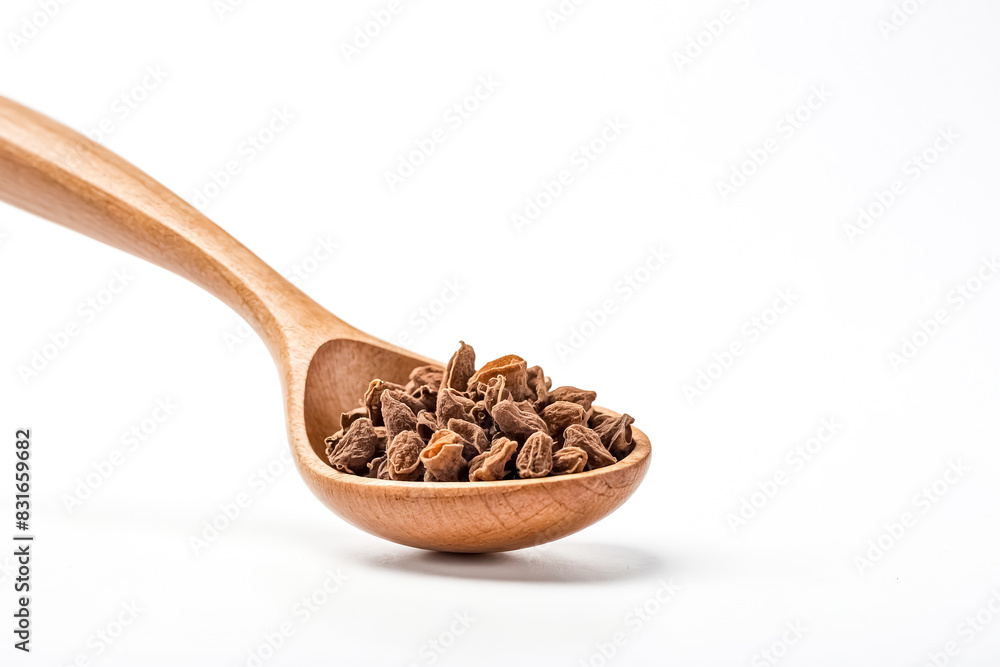 Closeup of Dried Cardamom Pods in Wooden Spoon on White Background Closeup of Dried Cardamom Pods in Wooden Spoon on White Background