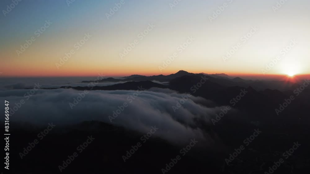 Aerial Forward Silhouette Of Tranquil Mountain Range In Fluffy Clouds - Calico Bluff, Alaska Aerial Forward Silhouette Of Tranquil Mountain Range In Fluffy Clouds - Calico Bluff, Alaska