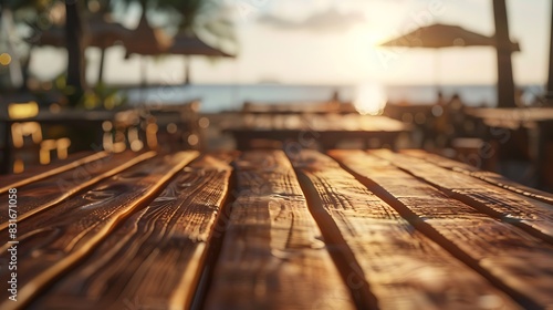 A wooden table bathed in sunlight, with beach cafes softly blurred in the background, creating a tranquil scene. photo