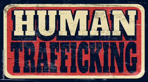 Aged and worn human trafficking sign on wood