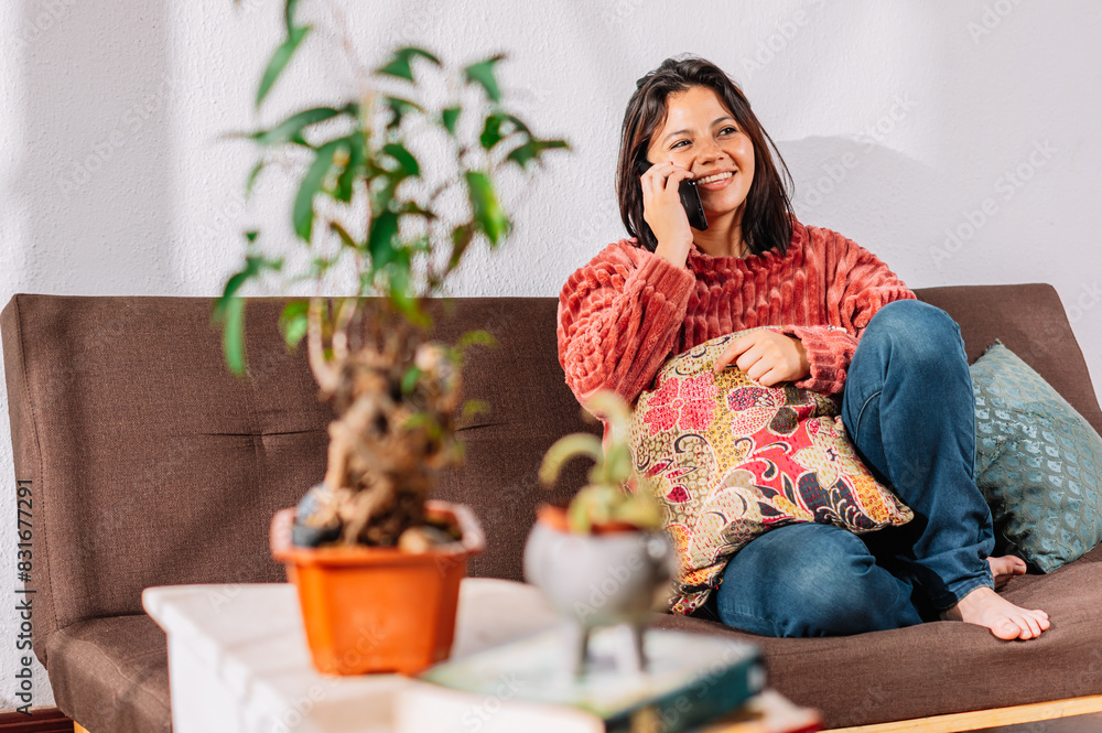 latina woman receiving positive news by phone call latina woman receiving positive news by phone call