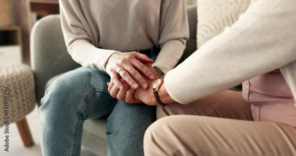 Holding hands, support and senior person help in living room and retirement home with empathy and care. Kindness, together and homecare with gratitude, love and trust with hope from family in house Holding hands, support and senior person help in living room and retirement home with empathy and care. Kindness, together and homecare with gratitude, love and trust with hope from family in house