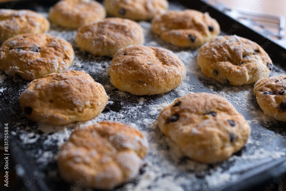 Cookies with chocolate pieces in a baking tray. Homemade baking.