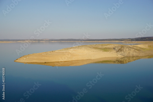 reflections in the water of the Valdecañas reservoir in Extremadura photo