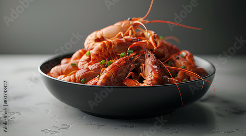 Pile of fresh red crayfish in a black bowl against a gray background, in the style of a Chinese delicacy prepared for hot pot. Generative AI.