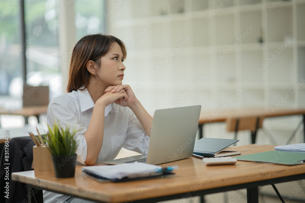 Asian business woman working with laptop at office. Asian business woman working with laptop at office.