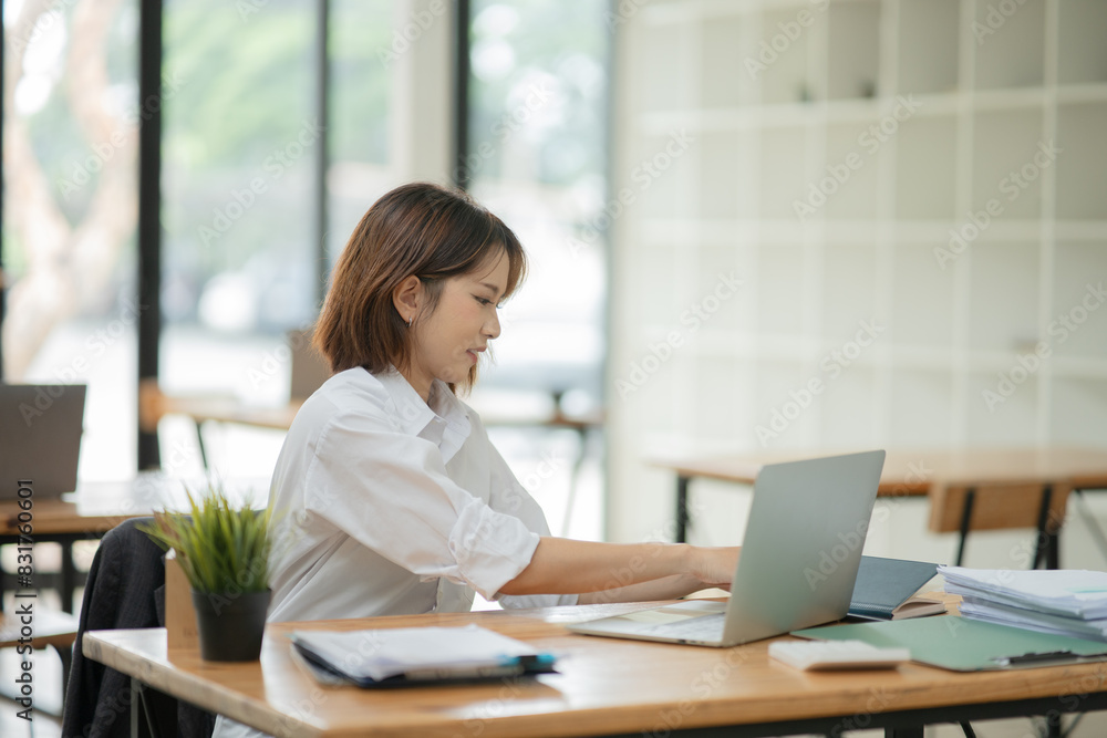 Asian business woman working with documents office. Asian business woman working with documents office.