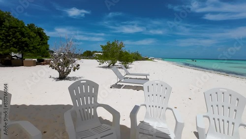 Outdoor umbrella and chairs, Cozy vibe home front caribbean beach, Madrisqui island photo