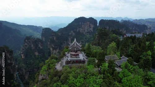 Majestic Liuqi Pavilion next to cable car and surrounding lush greenery in Zhangjiajie National Park, China. Aerial photo